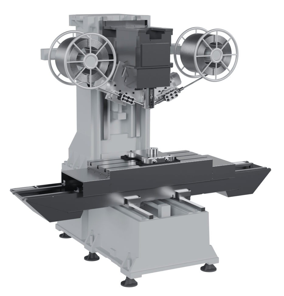 A gray industrial milling machine with rotating handles and a large worktable.